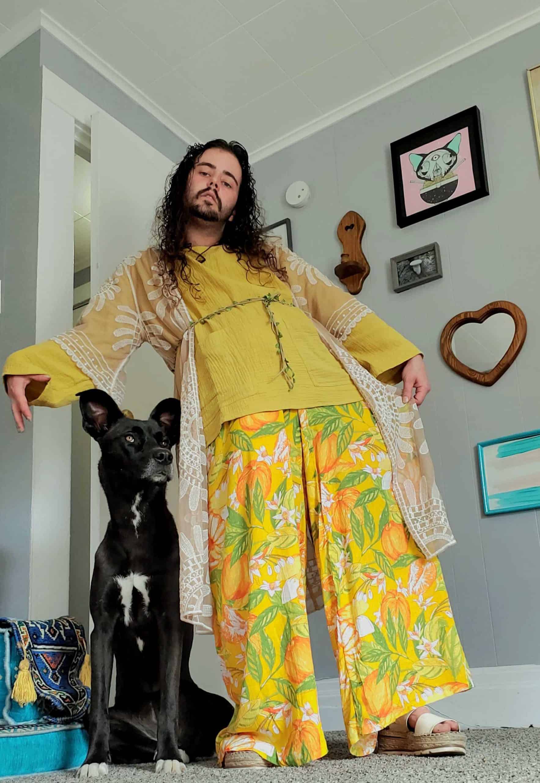 man with black dog